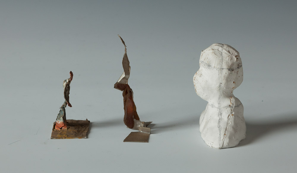 040 Three Sculptures  Left: h 1.75" x w 1.5" x d 1"  Middle: h 2.625" x w 1.75" x d .75" Plaster: h 2.5" x w 2.75" x d 1.625"